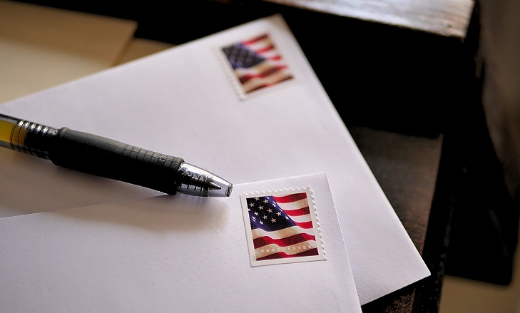 American,flag,stamps,on,letters,ready,to,be,mailed